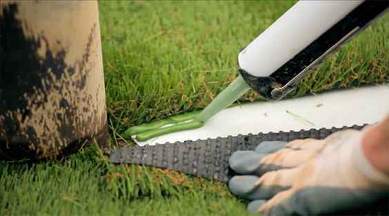 Cushion-Pad shock-absorbing tile installed under artificial grass in Perth.
